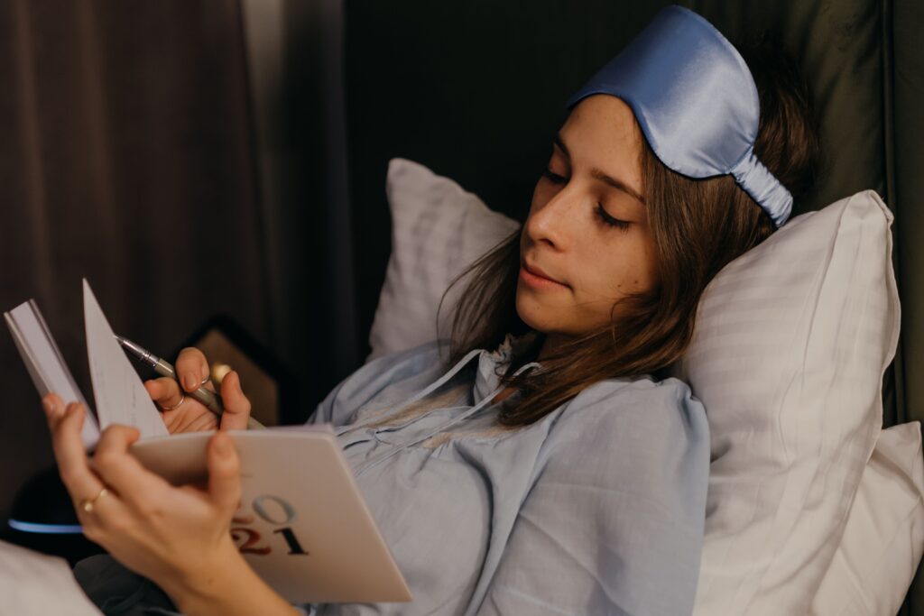Person following a relaxing night routine to sleep better
