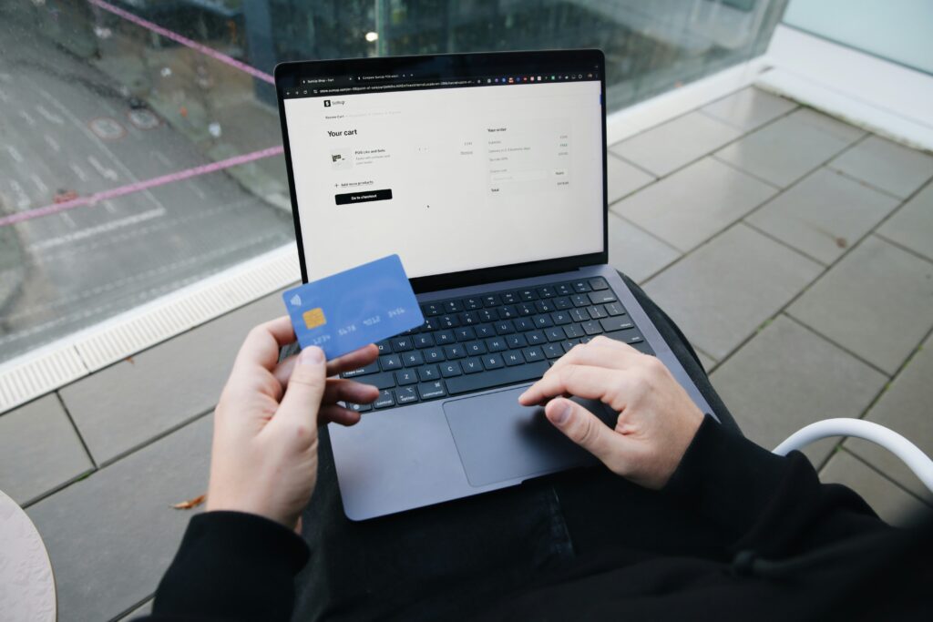 Person pausing before making an impulse purchase online.
